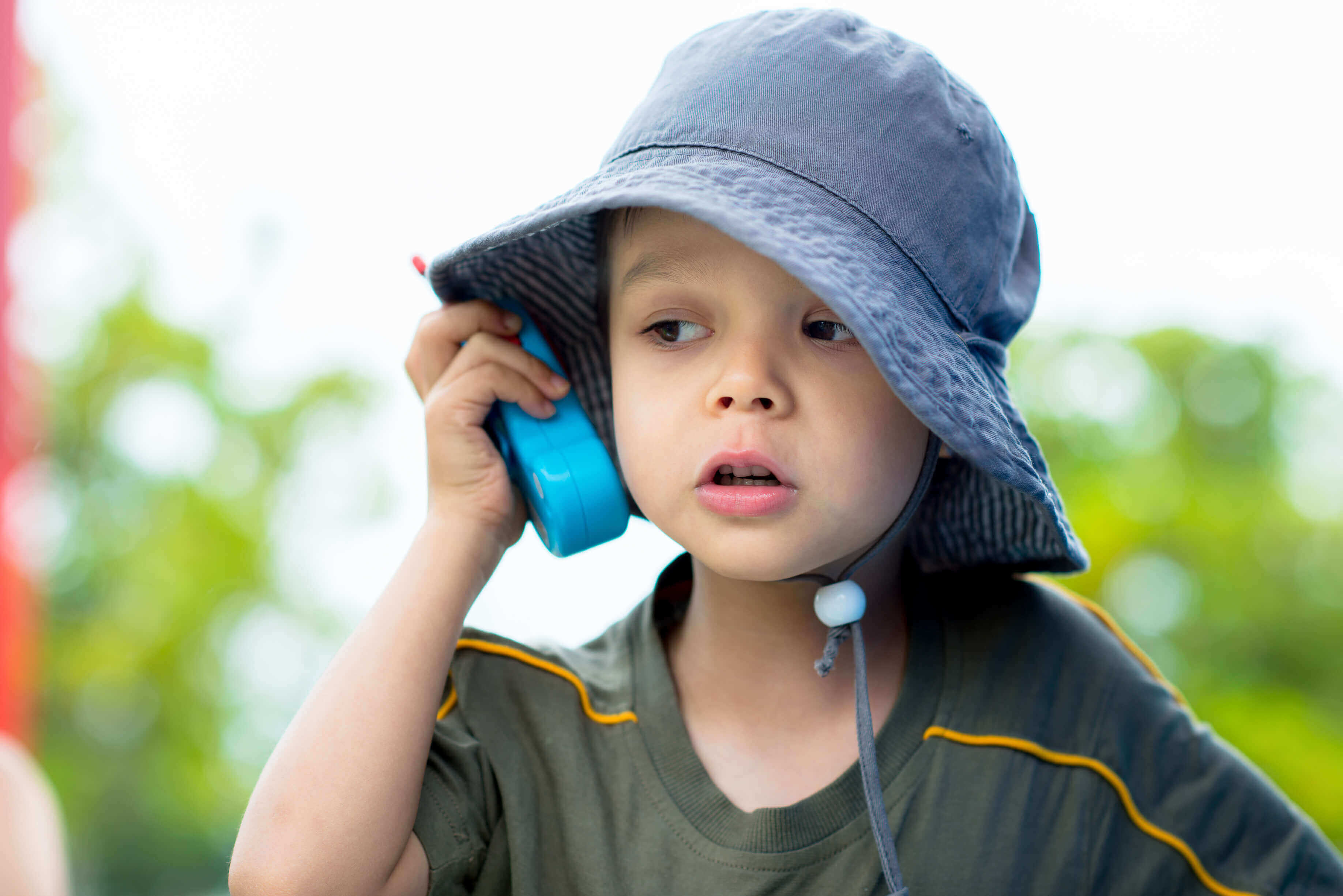 Child with toy walkie talkie